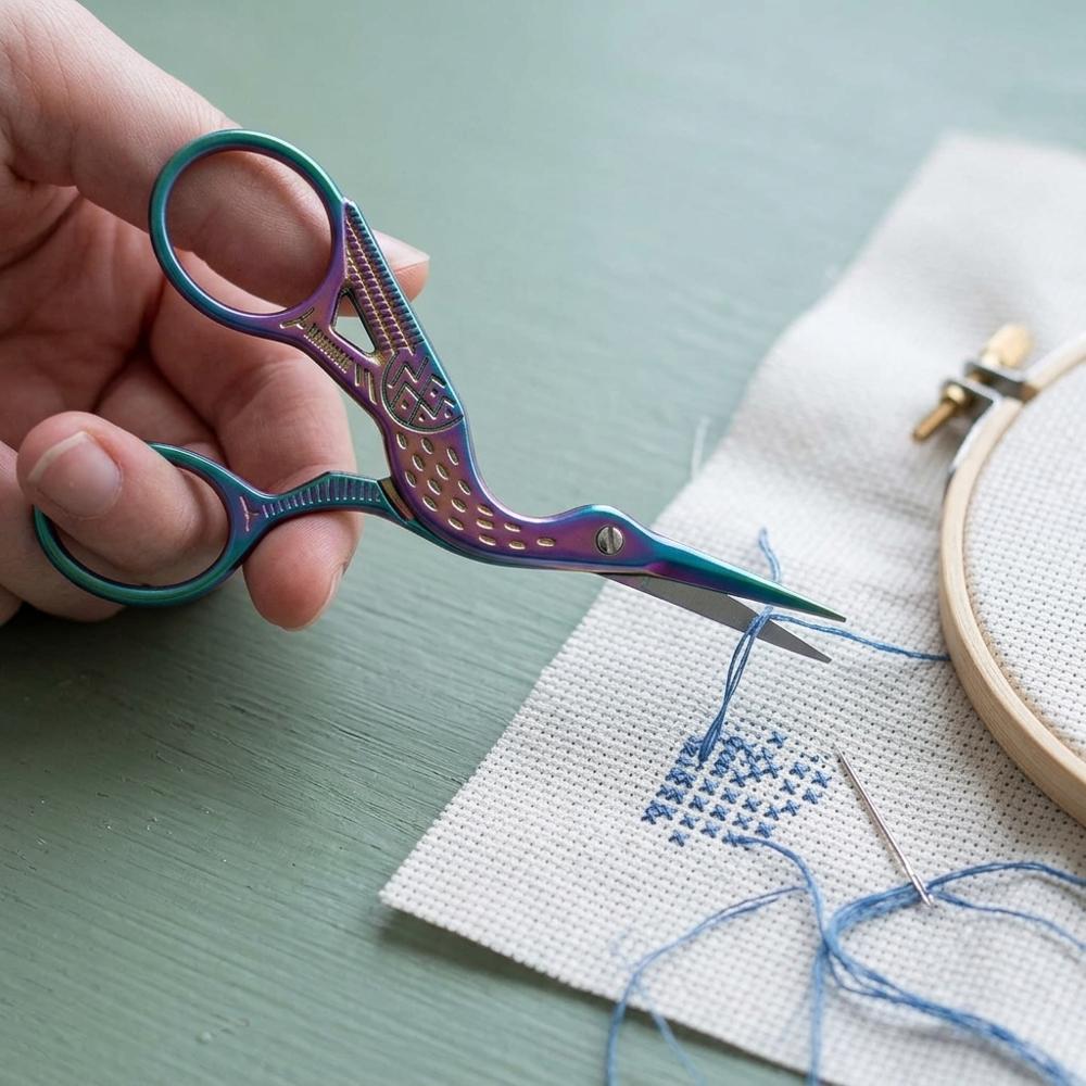 small stork-shaped embroidery scissors for trimming cross-stitch thread tails close to fabric