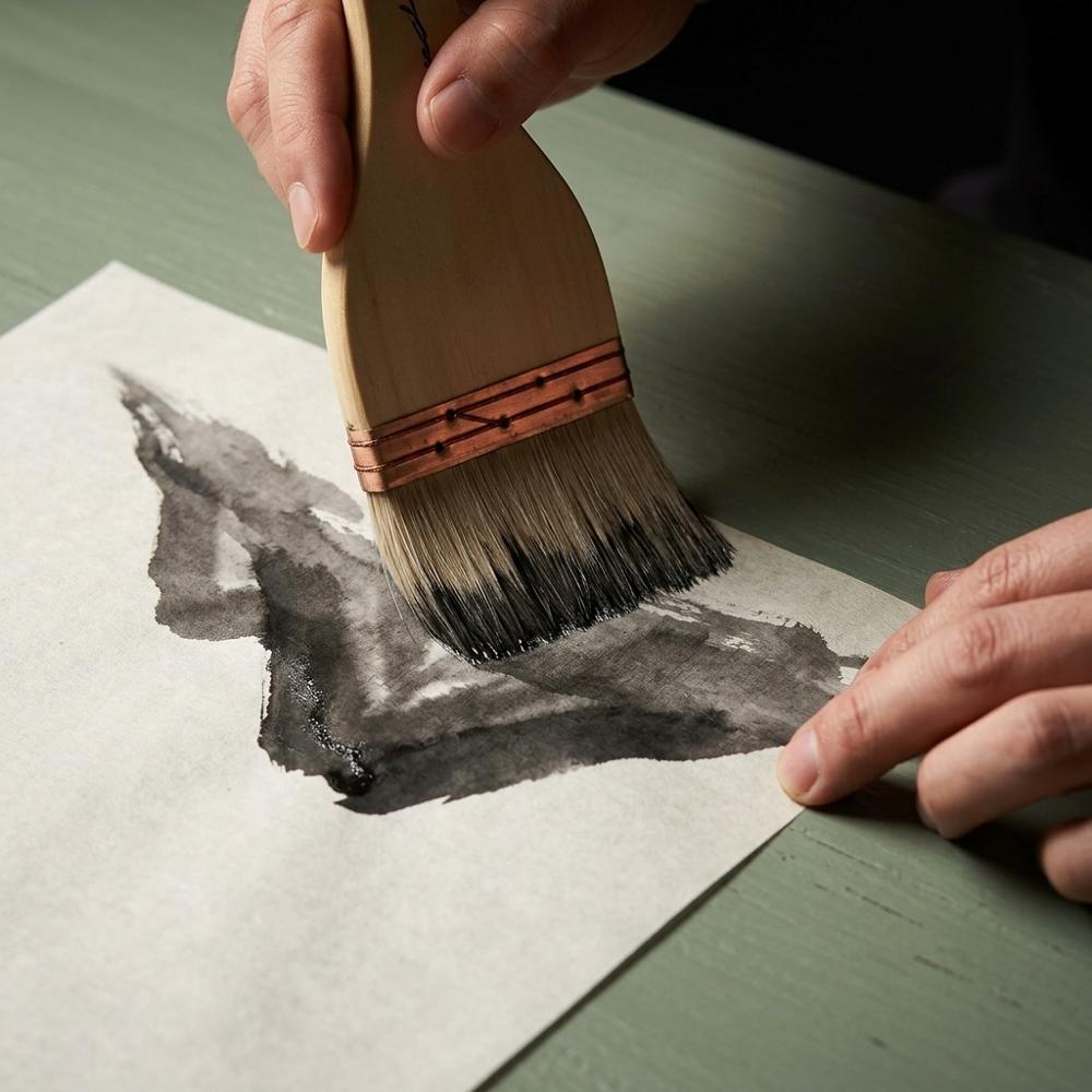 wide flat goat-hair brushes for skies and background washes