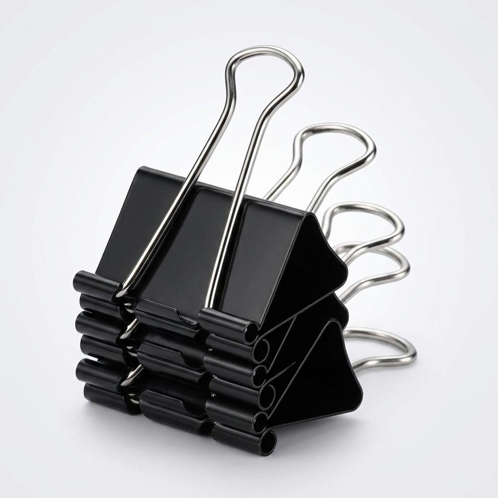 Small binder clips to tame pages in the wind