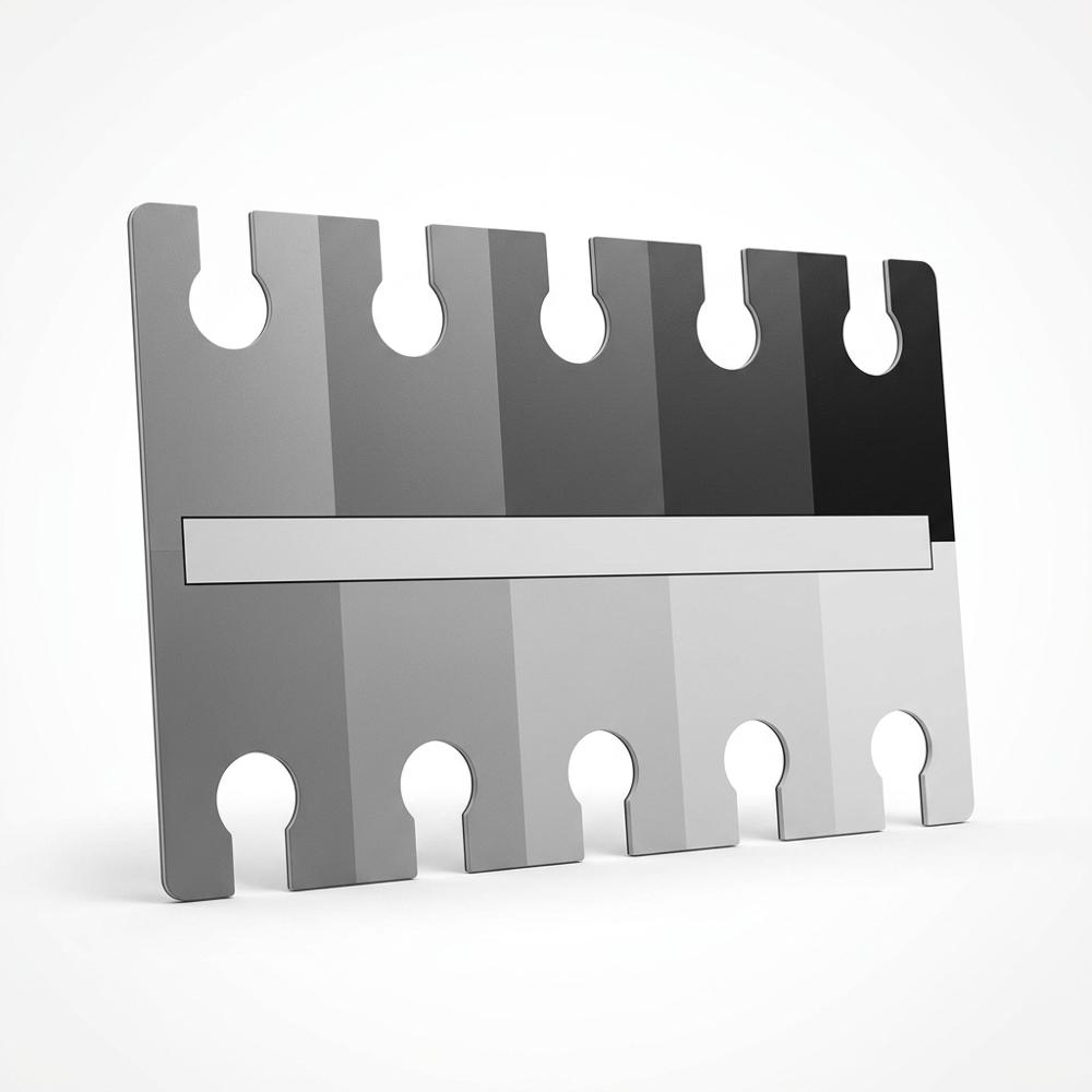 printed grey scale card with cut-out holes for judging portrait values
